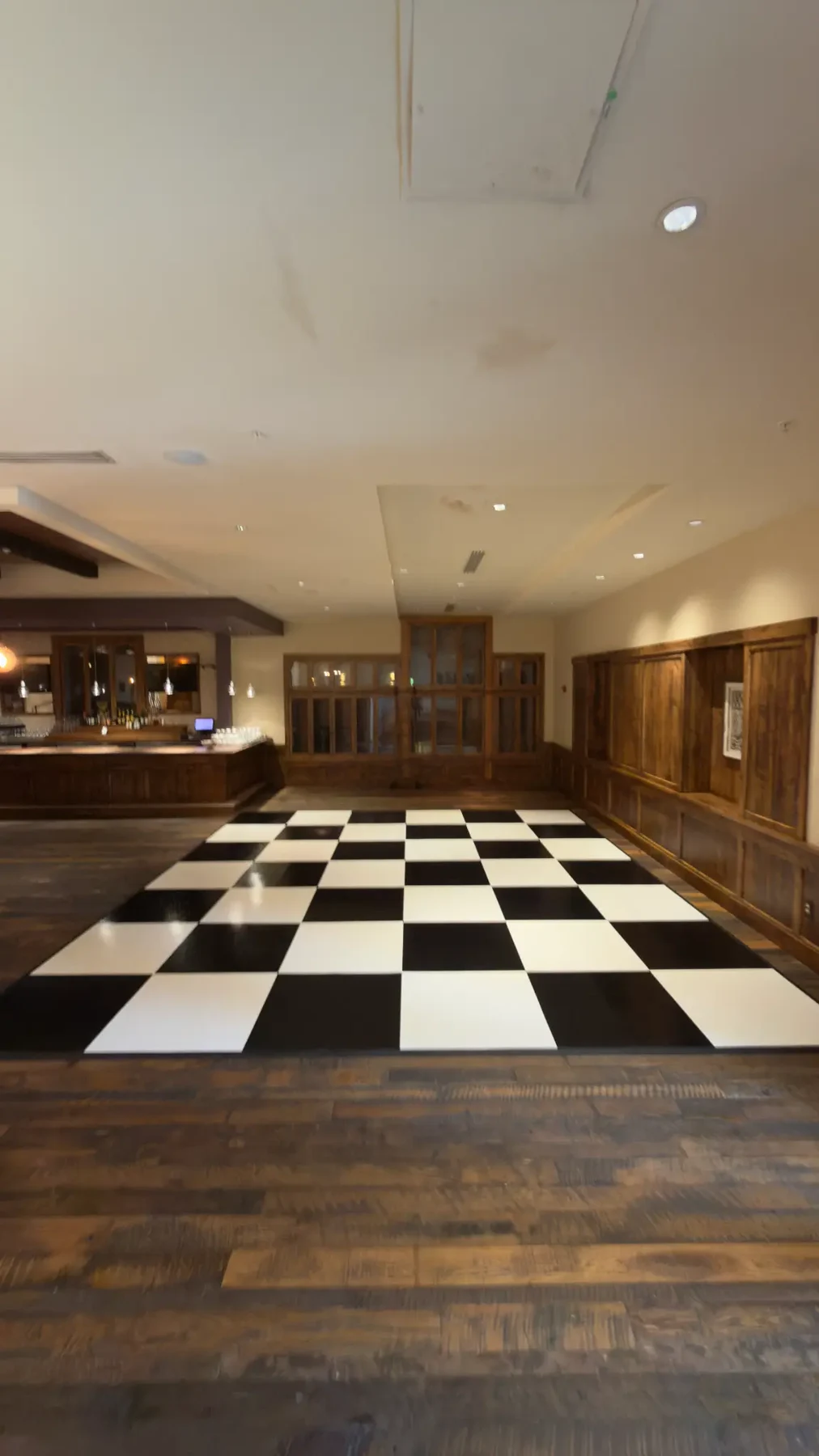 Real checkerboard dance floor photographed before guests begin dancing